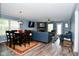 Bright living area open to dining space, offering a modern stone fireplace and plenty of natural light at 10622 Young Lake Dr, Indianapolis, IN 46239