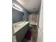 Bathroom featuring double sink vanity and shower with decorative curtains at 1071 Hazelwood Dr, Greenwood, IN 46143