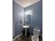 Cozy half bathroom featuring a pedestal sink, and modern lighting at 1071 Hazelwood Dr, Greenwood, IN 46143