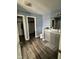 Bathroom features a modern vanity with gray cabinets and wood-look flooring at 1071 Hazelwood Dr, Greenwood, IN 46143