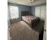 Bedroom with blue walls, carpeted floor, and a ceiling fan at 1071 Hazelwood Dr, Greenwood, IN 46143