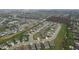 Neighborhood aerial view shows how homes line the street and are surrounded by healthy, green lawns at 11450 Wicker Ln, Noblesville, IN 46060