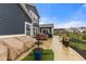 Spacious backyard with a cozy patio area featuring furniture and greenery at 11450 Wicker Ln, Noblesville, IN 46060