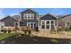 Enjoy outdoor living with a spacious patio, lush lawn, and landscaped beds with fresh mulch at 11450 Wicker Ln, Noblesville, IN 46060