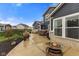 Backyard patio featuring outdoor furniture, plants and a view of the landscaped yard and neighborhood at 11450 Wicker Ln, Noblesville, IN 46060