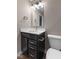 Bathroom featuring a modern vanity with white countertop and dark wood cabinets with a toilet at 11450 Wicker Ln, Noblesville, IN 46060
