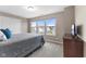 Comfortable bedroom featuring multiple windows for plenty of natural light and neutral color palette at 11450 Wicker Ln, Noblesville, IN 46060