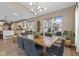Formal dining room features modern lighting and large windows at 11450 Wicker Ln, Noblesville, IN 46060