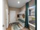 Inviting entryway featuring a built-in bench with storage, a bright window, and stylish decor at 11450 Wicker Ln, Noblesville, IN 46060