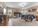Bright and airy main bedroom boasts large windows, a cozy fireplace, and comfortable furnishings at 11450 Wicker Ln, Noblesville, IN 46060