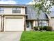 Charming townhome with attached garage, well-maintained lawn, and a welcoming front entrance at 1198 Paradise N Way # C, Greenwood, IN 46143