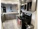 Well-equipped kitchen with modern appliances, open to dining area, and plenty of counter space at 1198 Paradise N Way # C, Greenwood, IN 46143