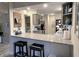 Modern kitchen with stone countertops, stainless appliances, and seating at the bar at 1198 Paradise N Way # C, Greenwood, IN 46143