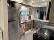 Functional kitchen featuring stainless steel appliances, ample counter space, and gray cabinetry at 1198 Paradise N Way # C, Greenwood, IN 46143