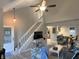 Bright living room with stairs, an open layout, and view of the kitchen/dining, filled with natural light at 1198 Paradise N Way # C, Greenwood, IN 46143