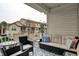 Relaxing balcony showcasing comfortable seating and view of neighborhood buildings at 12658 Watford Way, Fishers, IN 46037