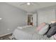 Comfortable bedroom featuring plush bedding, carpet flooring, and neutral wall color at 12658 Watford Way, Fishers, IN 46037