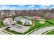 Community center with pool, tennis, playground, parking surrounded by green space and trees at 12658 Watford Way, Fishers, IN 46037