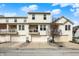 Inviting exterior view of townhome with attached garages and neutral siding under sunny skies at 12658 Watford Way, Fishers, IN 46037