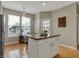 Eat-in kitchen boasts an island with seating, and lots of natural light at 12658 Watford Way, Fishers, IN 46037