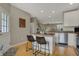 Kitchen featuring a center island with bar seating, an open floor plan and stainless steel appliances at 12658 Watford Way, Fishers, IN 46037