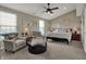 Spacious main bedroom boasts vaulted ceilings and comfortable seating at 12658 Watford Way, Fishers, IN 46037
