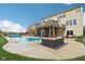 Outdoor pool area with an attached screened-in patio, deck, and lounge furniture at 13974 Nina Dr, Carmel, IN 46074