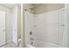 Bathroom with a white bathtub and shower, and an enclosed toilet room for added privacy at 13974 Nina Dr, Carmel, IN 46074