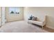 Neutral bedroom features a window and a soft settee with throw pillows and carpeted floor at 13974 Nina Dr, Carmel, IN 46074