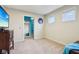 Bright bedroom with carpet, a closet, and natural light, offering comfort and functionality in a well-lit space at 13974 Nina Dr, Carmel, IN 46074