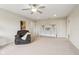 Spacious carpeted room with neutral walls, ceiling fan, and plenty of space, suitable for a bedroom or recreational area at 13974 Nina Dr, Carmel, IN 46074