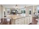 Bright open concept floor plan featuring a kitchen island with granite countertop at 13974 Nina Dr, Carmel, IN 46074