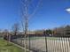 Community pool with a fence, a shelter, and mature trees surrounding the area at 13974 Nina Dr, Carmel, IN 46074