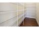 Walk-in pantry with wire shelving and hardwood floors, offering ample storage space at 13974 Nina Dr, Carmel, IN 46074