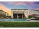 Backyard pool with screened in porch, patio with outdoor seating, and well maintained lawn at 13974 Nina Dr, Carmel, IN 46074