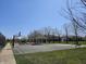 A community basketball court with playground nearby, offering a range of recreational activities for residents at 13974 Nina Dr, Carmel, IN 46074