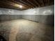 Unfinished basement space featuring sealed walls and exposed ceiling at 141 Creststone Blvd, Westfield, IN 46074