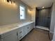 Bright bathroom with a double sink vanity and a tiled walk-in shower at 141 Creststone Blvd, Westfield, IN 46074