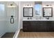 Modern bathroom featuring double vanities, a sleek shower with glass door, and a chic design at 141 Creststone Blvd, Westfield, IN 46074