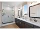 Spa-like bathroom with dual vanities, framed mirrors, and a glass-enclosed shower offering modern luxury at 141 Creststone Blvd, Westfield, IN 46074