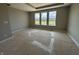 Neutral bedroom with a large window providing natural light and views of the yard at 141 Creststone Blvd, Westfield, IN 46074