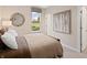 Cozy bedroom with a window view and neutral decor; perfect for relaxation at 141 Creststone Blvd, Westfield, IN 46074
