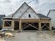 Exterior view of a home under construction, featuring wood framing and Tyvek wrap at 141 Creststone Blvd, Westfield, IN 46074