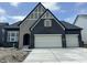Charming new construction home featuring a stylish mix of stone and brick exterior with an attached two-car garage at 141 Creststone Blvd, Westfield, IN 46074