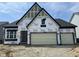 Under construction, a two-story home featuring a two-car garage and modern architectural details at 141 Creststone Blvd, Westfield, IN 46074