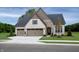 Beautiful new construction home with brick and stone, two-car garage, and professionally landscaped yard at 141 Creststone Blvd, Westfield, IN 46074