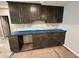 Dark kitchen cabinets with light backsplash at 141 Creststone Blvd, Westfield, IN 46074
