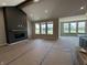 Spacious living room with fireplace and large windows providing ample natural light at 141 Creststone Blvd, Westfield, IN 46074