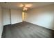 Spacious bedroom featuring neutral carpet, ceiling fan, and ample natural light from a nearby hallway at 14243 Clapboard Dr, Noblesville, IN 46060