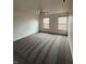 Inviting bedroom with neutral carpet, ceiling fan, and natural light streaming through the window at 14243 Clapboard Dr, Noblesville, IN 46060